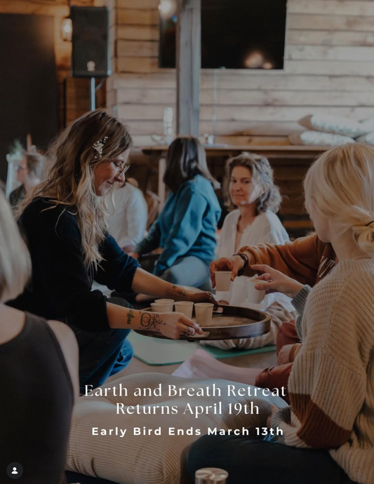 Group of people sitting together in a wooden cabin setting, with text about an Earth and Breath Retreat.